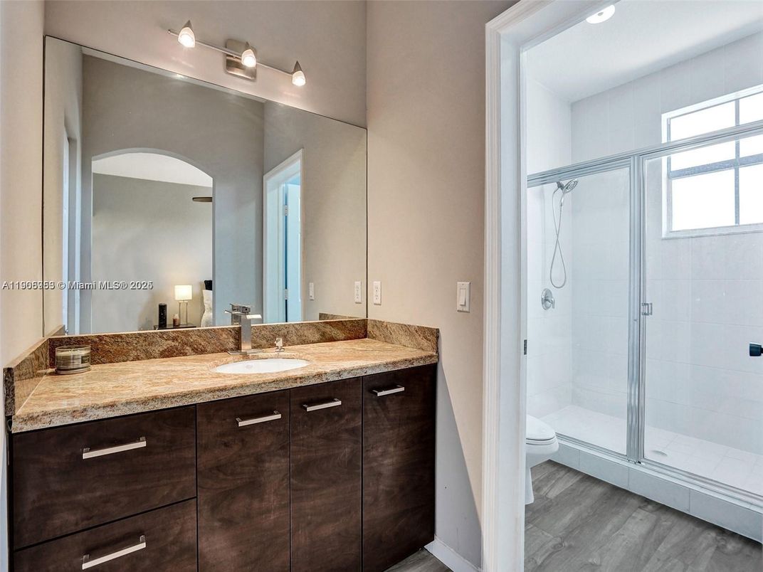 Bathroom, Dual Sink Vanities, Glass Shower, Interior, Wood Texture Flooring