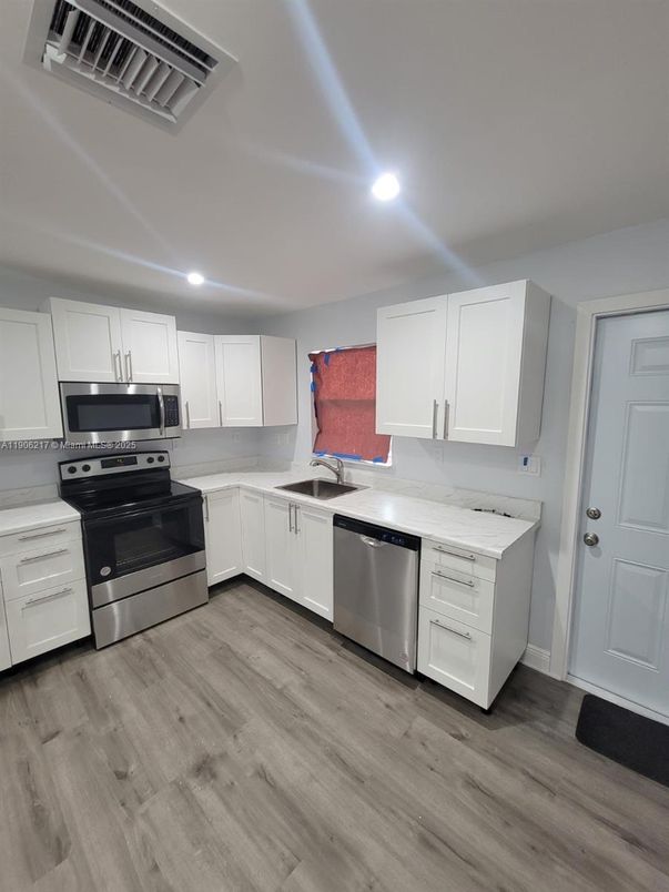 Interior, Kitchen, Recessed Lighting, Stainless Steel Appliances, Wood Texture Flooring