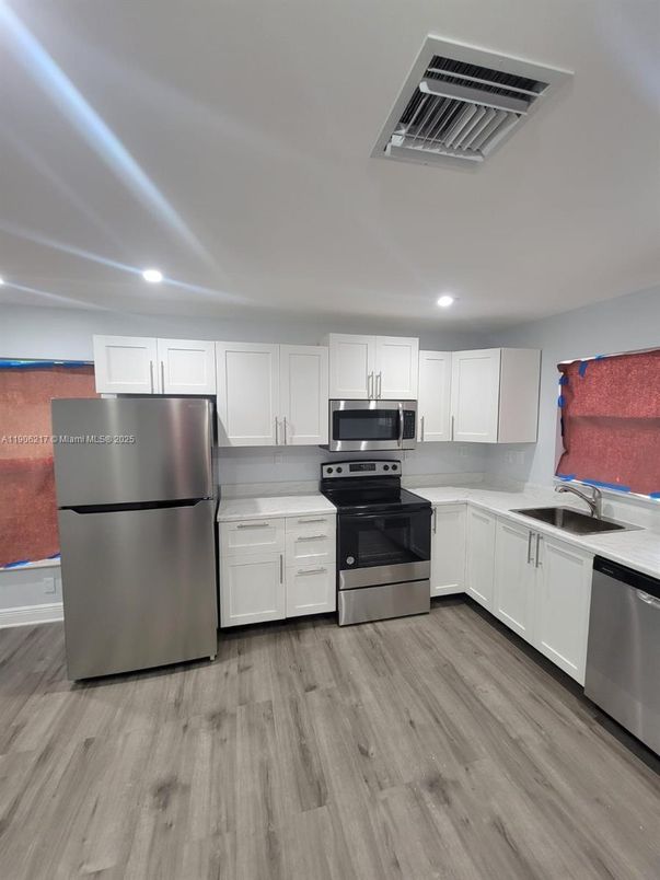 Interior, Kitchen, Recessed Lighting, Stainless Steel Appliances, Wood Texture Flooring