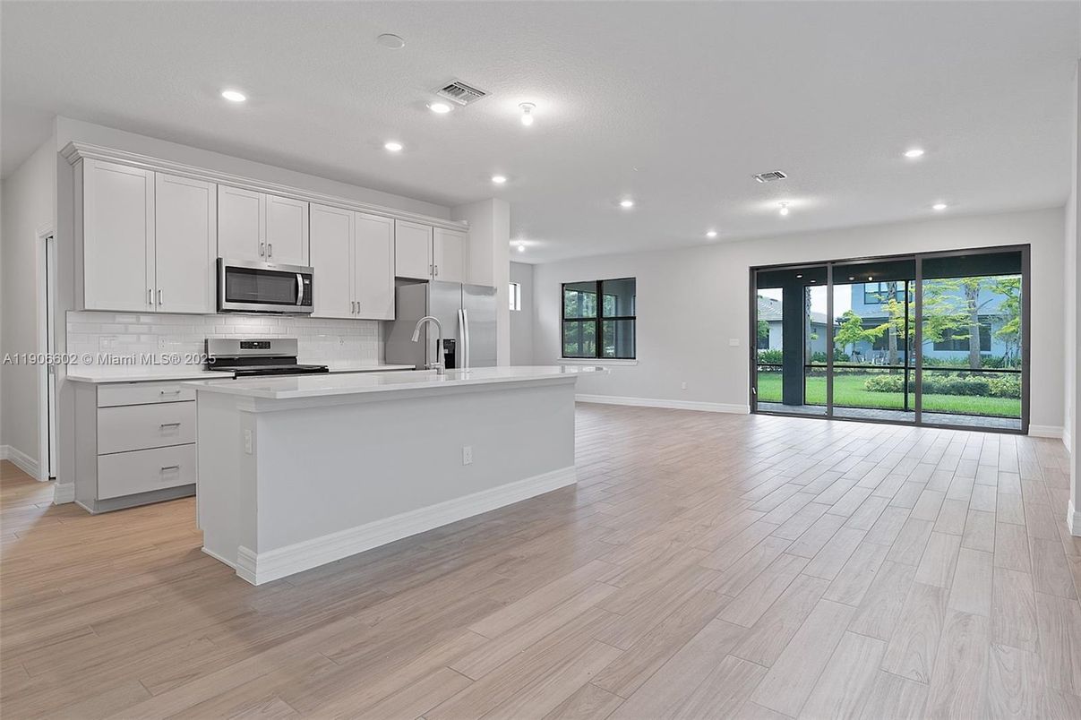 Interior, Kitchen, Recessed Lighting, Stainless Steel Appliances, Wood Texture Flooring