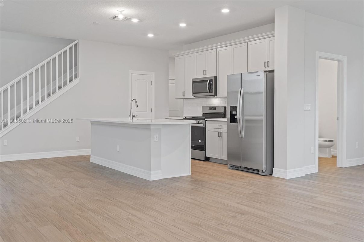 Interior, Kitchen, Recessed Lighting, Stainless Steel Appliances, Wood Texture Flooring