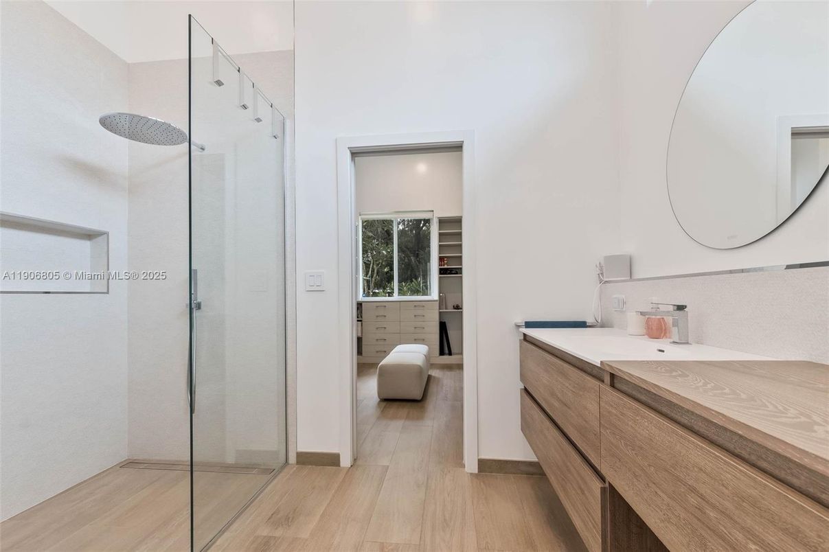 Bathroom, Dual Sink Vanities, Glass Shower, Interior, Recessed Lighting, Wood Texture Flooring