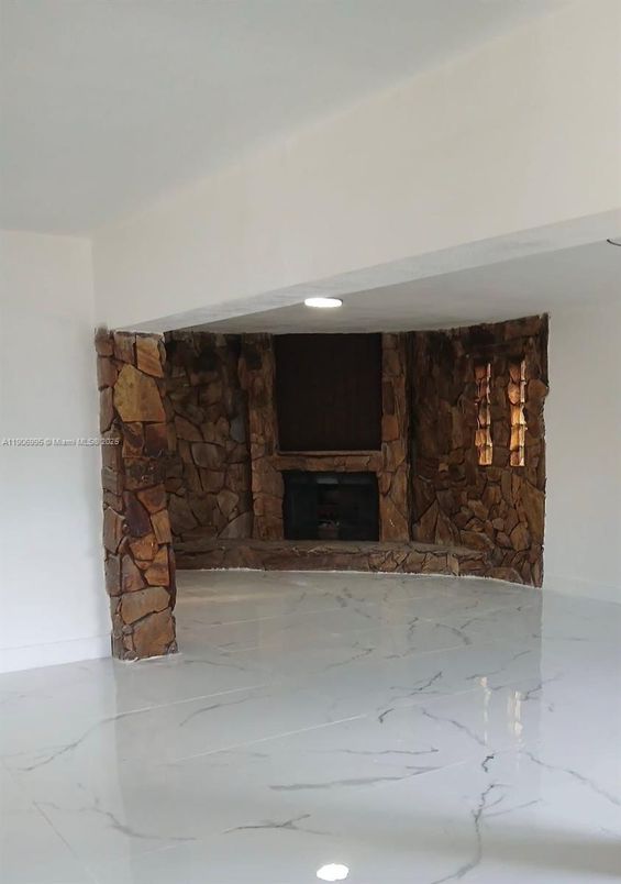 Empty room, Fireplace, Interior, Marble, Recessed Lighting, Stone Walls
