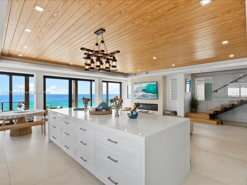 Dining room, Fireplace, Interior, Kitchen, Pendant Lights, Recessed Lighting, Water, Wooden Ceilings