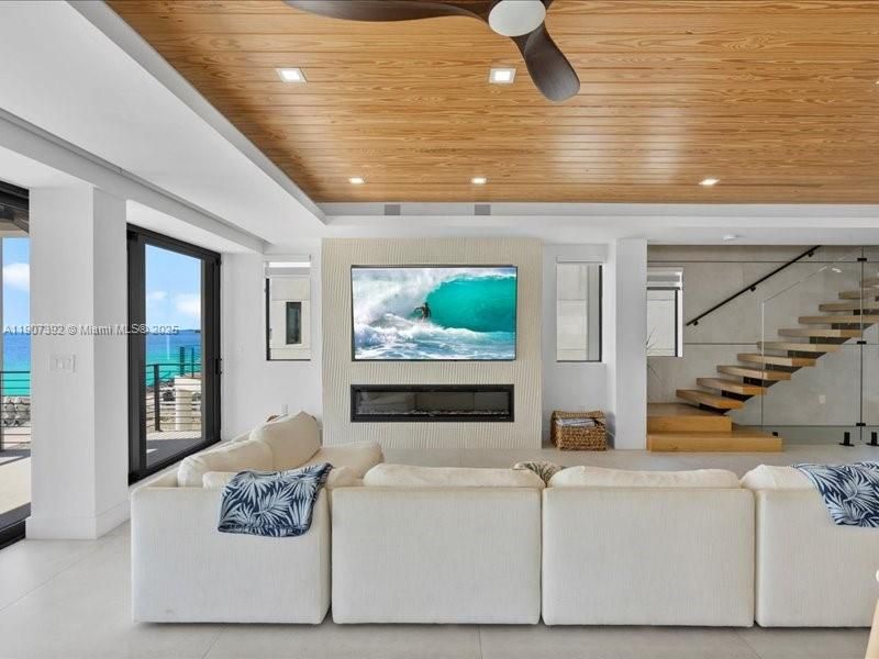 Fireplace, Interior, Living room, Recessed Lighting, Water, Wooden Ceilings