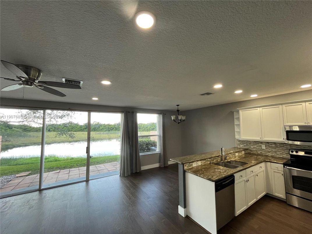 Chandelier, Interior, Kitchen, Recessed Lighting, Stainless Steel Appliances, Wood Texture Flooring