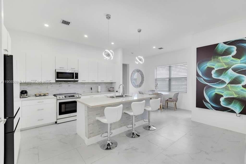 Dining room, Interior, Kitchen, Marble, Pendant Lights, Recessed Lighting, Stainless Steel Appliances