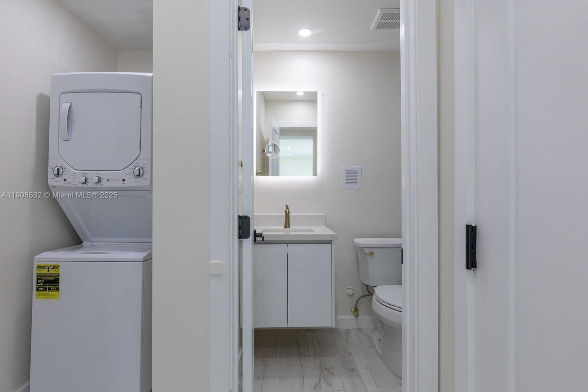 Bathroom, Interior, Recessed Lighting, Utility Closets, Washer, Wood Texture Flooring