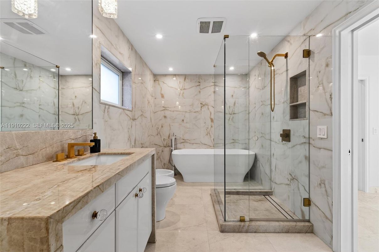 Bathroom, Dual Sink Vanities, Free Standing Baths, Glass Shower, Interior, Marble Walls, Recessed Lighting