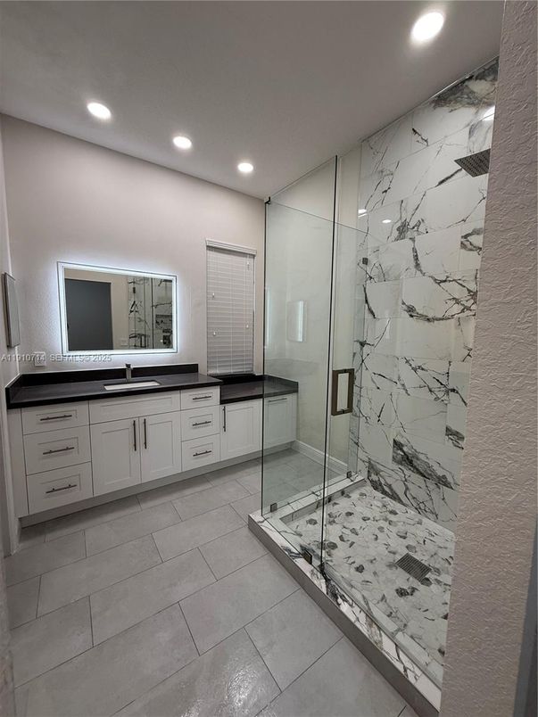 Bathroom, Dual Sink Vanities, Glass Shower, Interior, Marble Walls, Recessed Lighting