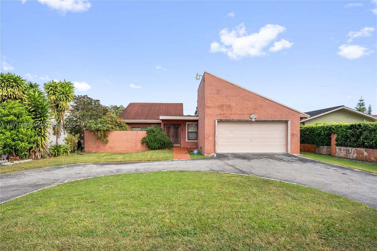 Attached, Backyard, Exterior, Facade, Brick Facade, Spanish Mediterranean