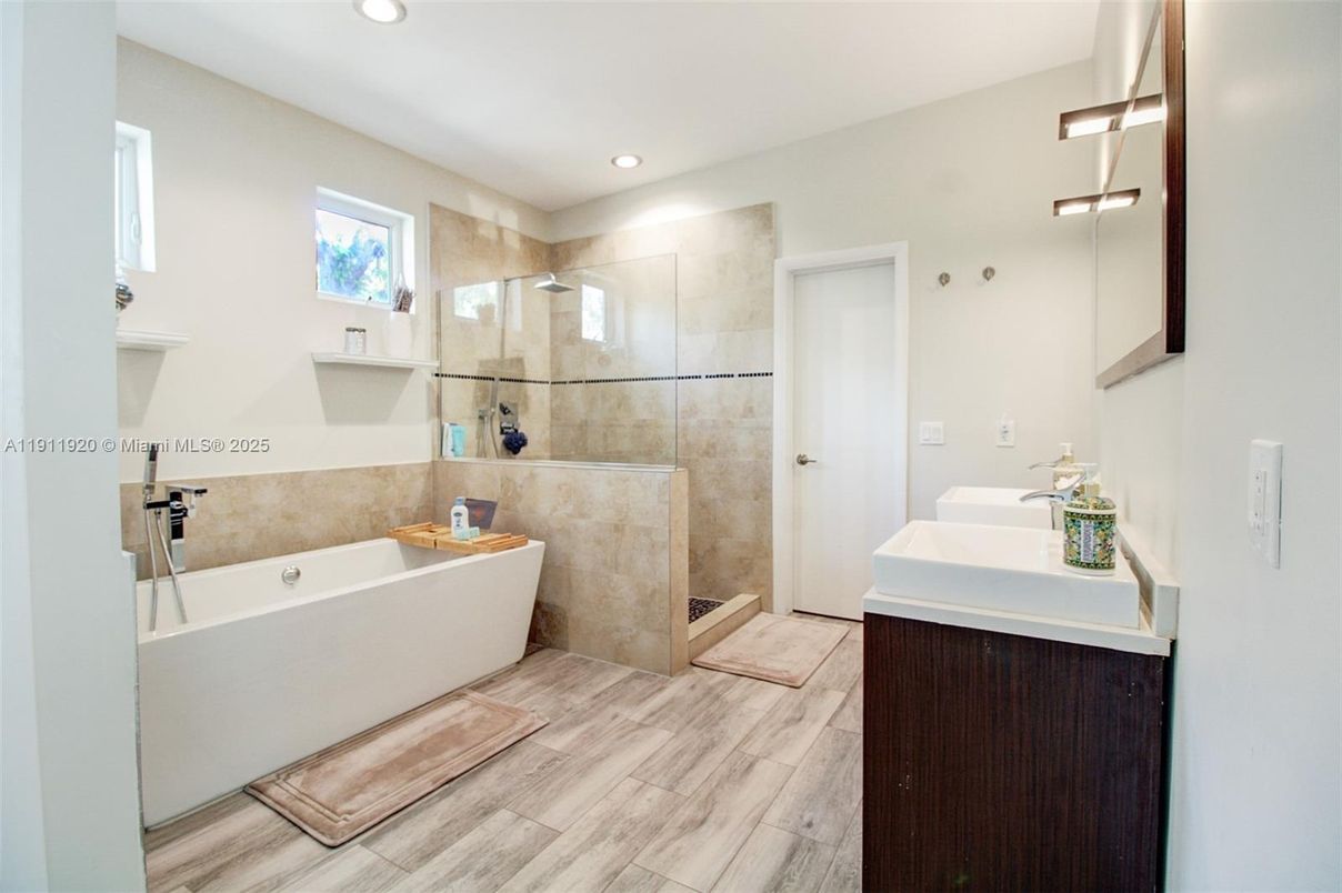 Bathroom, Free Standing Baths, Glass Shower, Interior, Recessed Lighting, Wood Texture Flooring