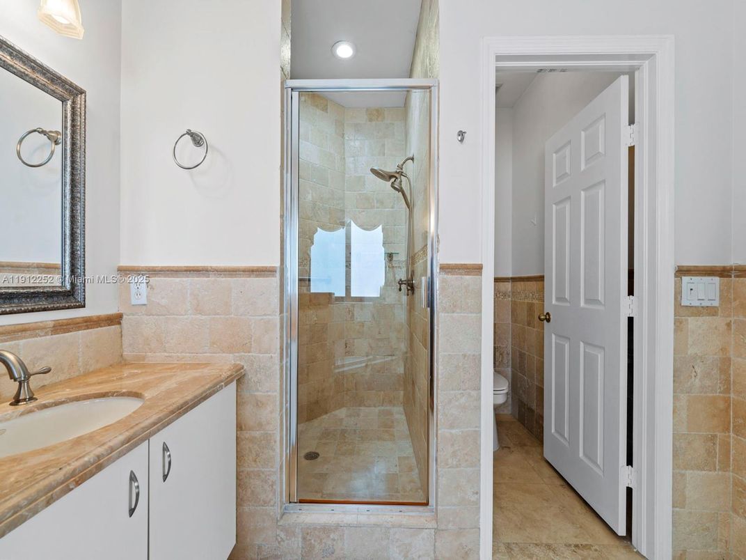 Bathroom, Glass Shower, Interior, Recessed Lighting, Stone Walls