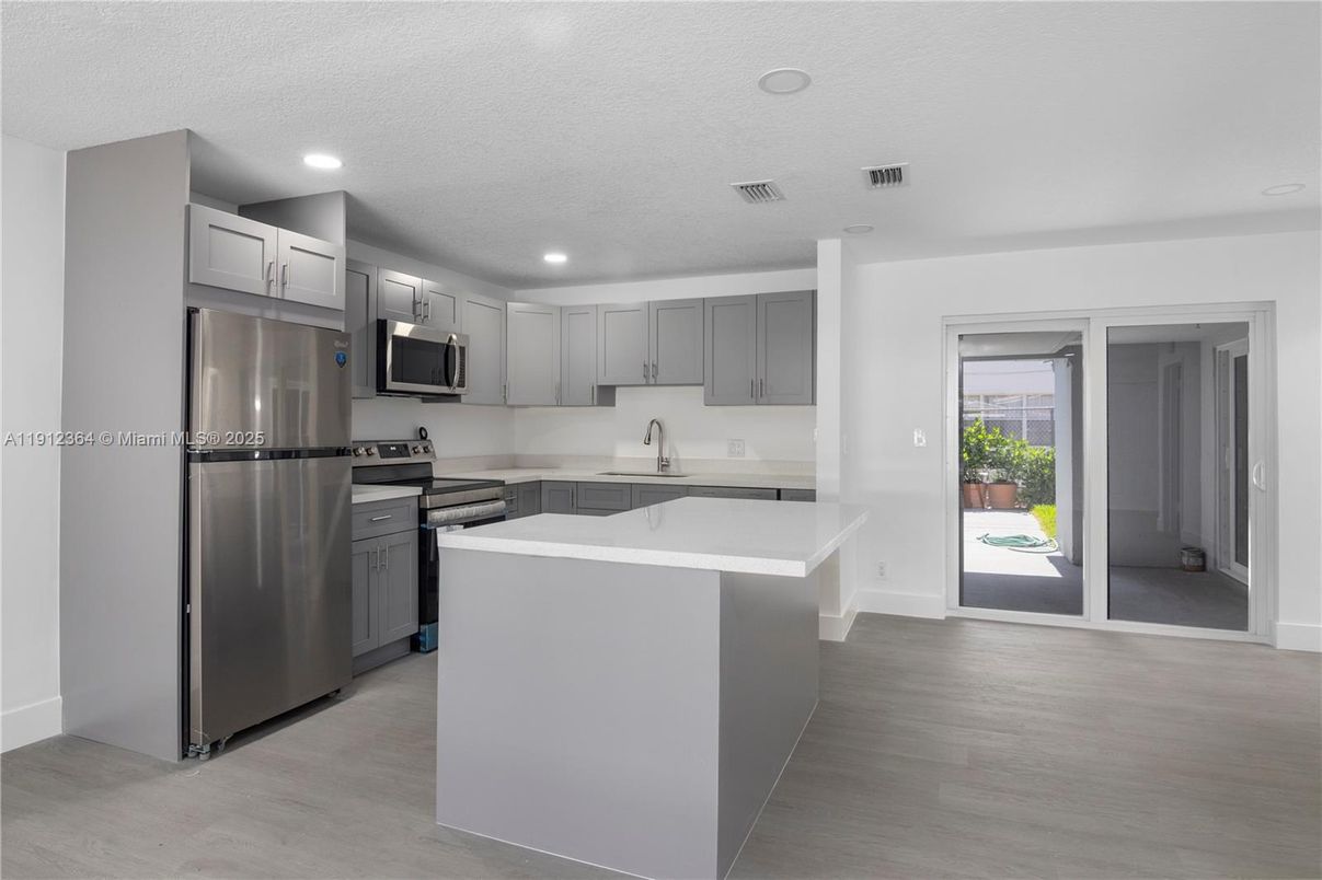 Interior, Kitchen, Recessed Lighting, Stainless Steel Appliances, Wood Texture Flooring