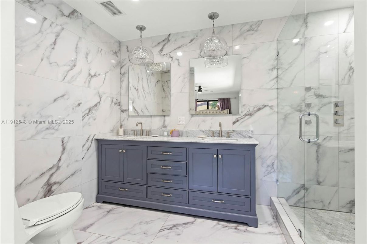 Bathroom, Dual Sink Vanities, Glass Shower, Interior, Marble, Marble Walls, Pendant Lights