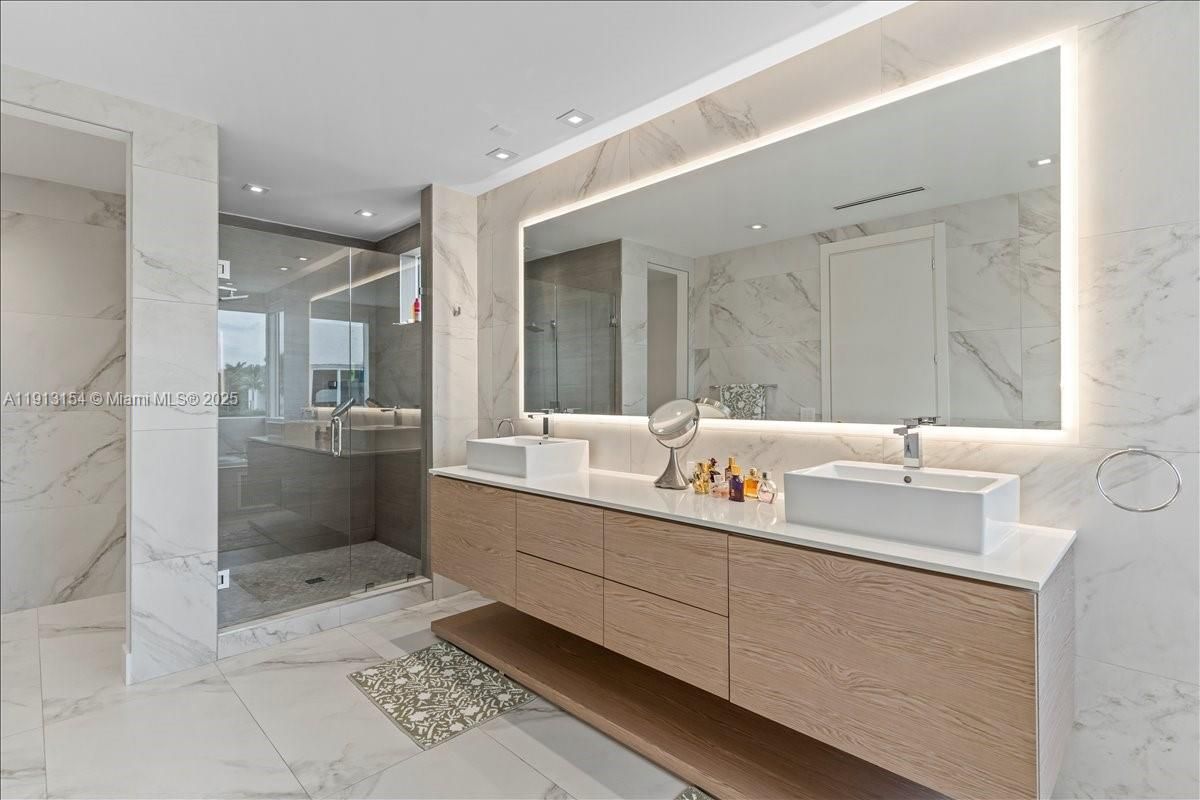 Bathroom, Dual Sink Vanities, Glass Shower, Interior, Marble, Marble Walls, Recessed Lighting
