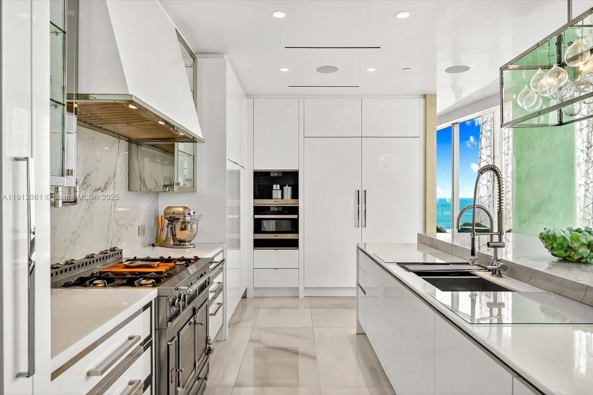 Interior, Kitchen, Marble Walls, Recessed Lighting, Stainless Steel Appliances, Water