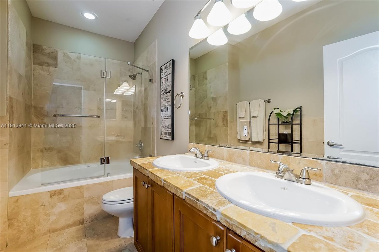 Bathroom, Dual Sink Vanities, Glass Shower, Interior, Recessed Lighting, Tile Countertops