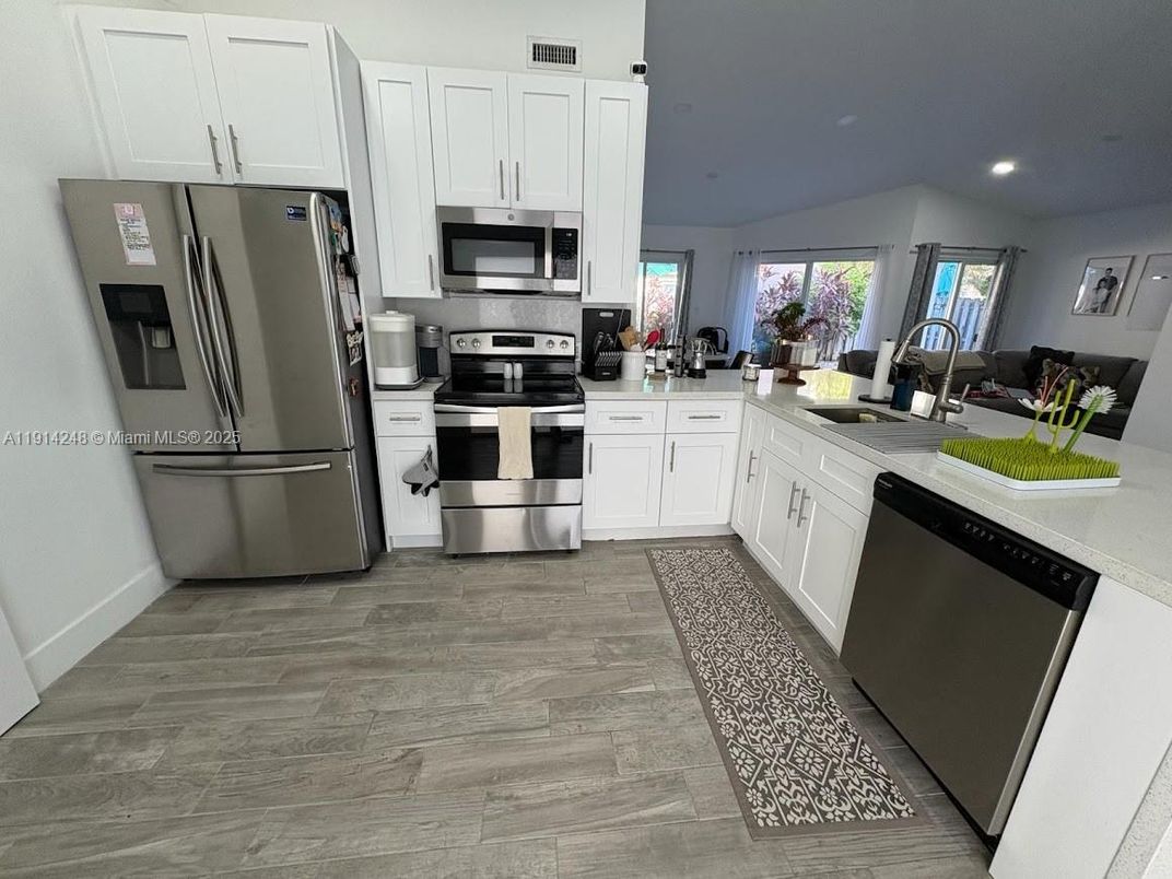 Interior, Kitchen, Recessed Lighting, Stainless Steel Appliances, Wood Texture Flooring