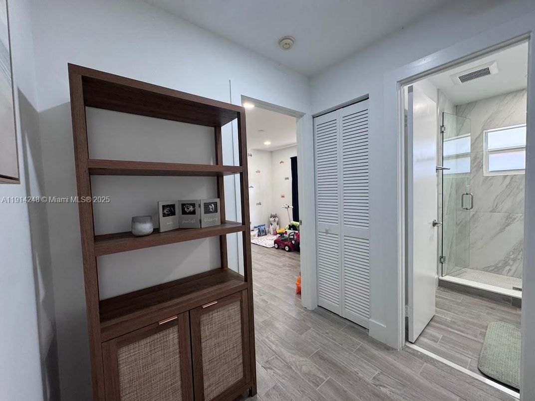 Bathroom, Glass Shower, Interior, Marble Walls, Recessed Lighting, Wood Texture Flooring