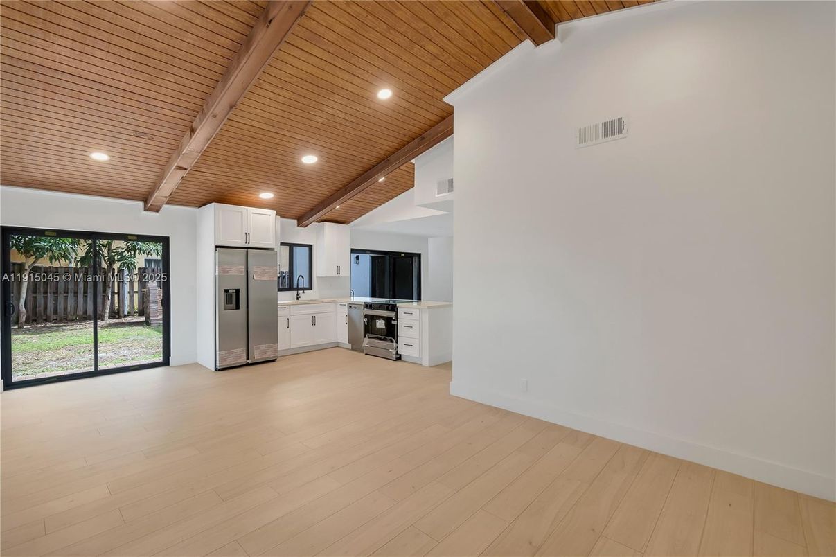 Empty room, Interior, Kitchen, Recessed Lighting, Stainless Steel Appliances, Wooden Beams, Wooden Ceilings, Wood Texture Flooring