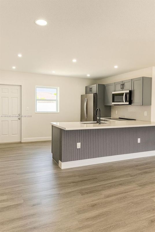 Interior, Kitchen, Recessed Lighting, Stainless Steel Appliances, Wood Texture Flooring