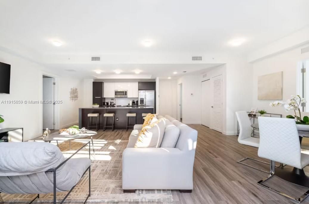 Dining room, Interior, Kitchen, Living room, Recessed Lighting, Stainless Steel Appliances, Wood Texture Flooring