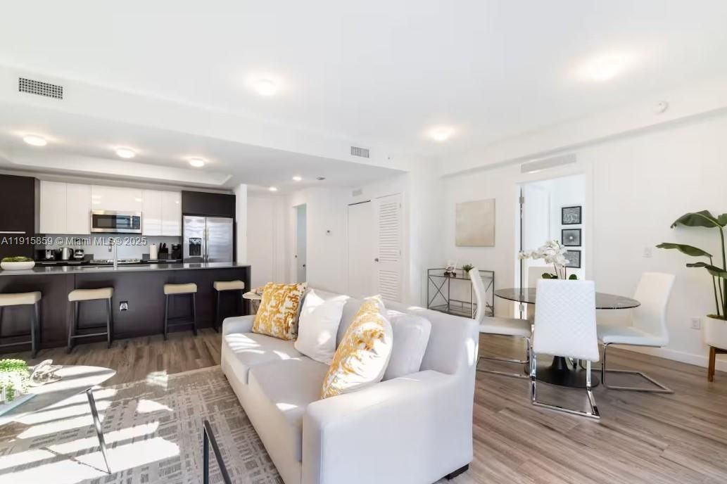 Dining room, Interior, Kitchen, Living room, Recessed Lighting, Stainless Steel Appliances, Wood Texture Flooring