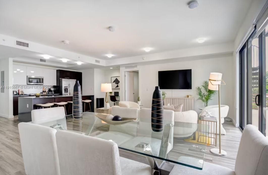 Dining room, Interior, Kitchen, Living room, Recessed Lighting, Stainless Steel Appliances, Wood Texture Flooring