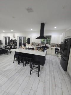 Dining room, Interior, Kitchen, Living room, Recessed Lighting, Stainless Steel Appliances, Wood Texture Flooring