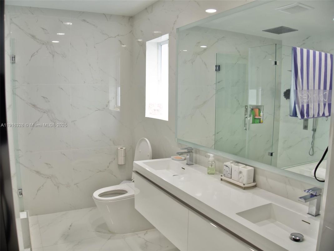 Bathroom, Dual Sink Vanities, Glass Shower, Interior, Marble, Marble Walls, Recessed Lighting