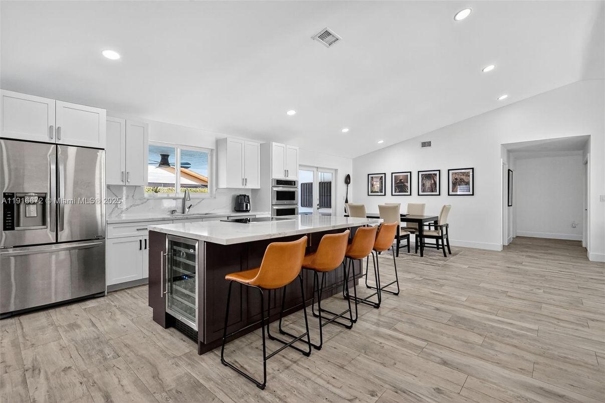 Dining room, Interior, Kitchen, Recessed Lighting, Stainless Steel Appliances, Wood Texture Flooring