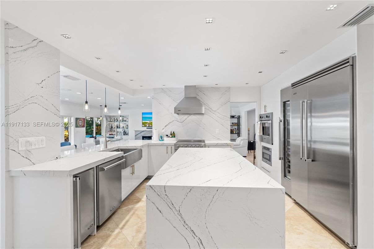 Interior, Kitchen, Marble Walls, Pendant Lights, Recessed Lighting, Stainless Steel Appliances