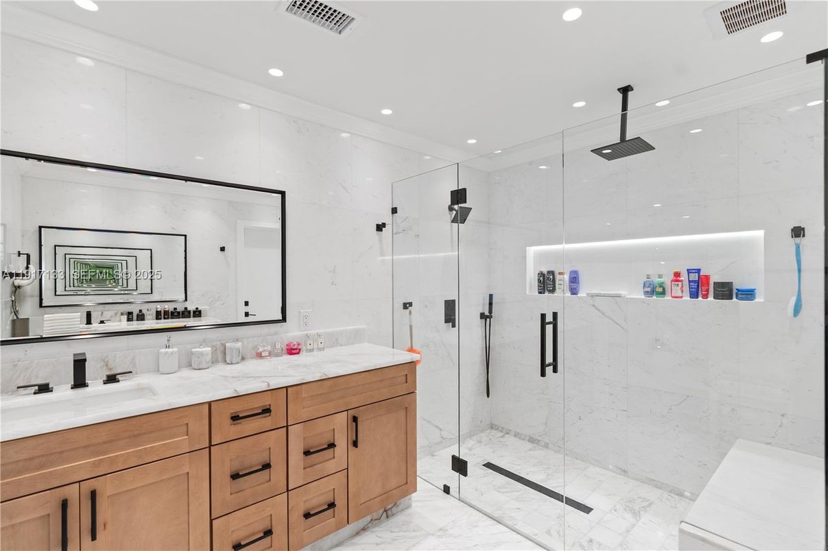 Bathroom, Dual Sink Vanities, Glass Shower, Interior, Marble, Marble Walls, Recessed Lighting