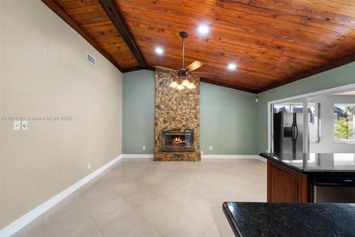Empty room, Fireplace, Interior, Recessed Lighting, Stone Walls, Wooden Beams, Wooden Ceilings