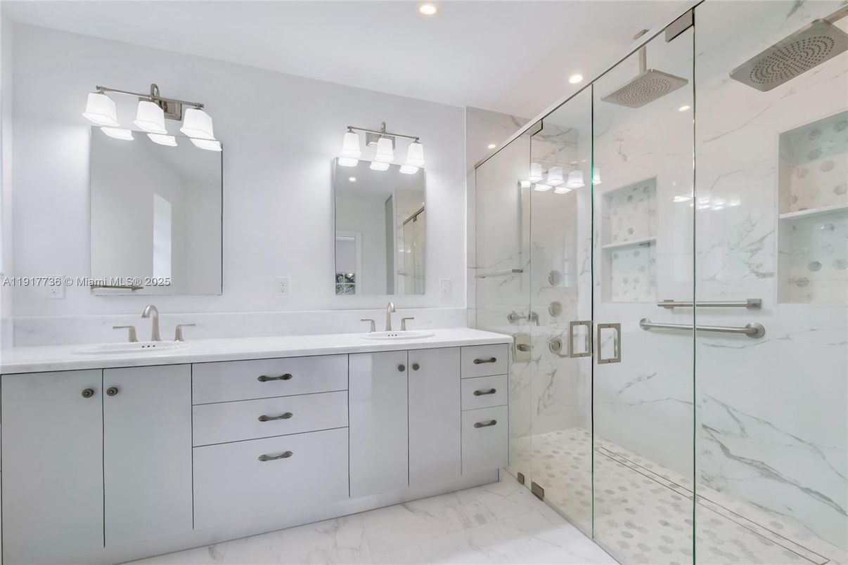 Bathroom, Dual Sink Vanities, Glass Shower, Interior, Marble, Marble Walls, Recessed Lighting