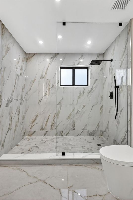 Bathroom, Free Standing Baths, Glass Shower, Interior, Marble, Marble Walls, Recessed Lighting