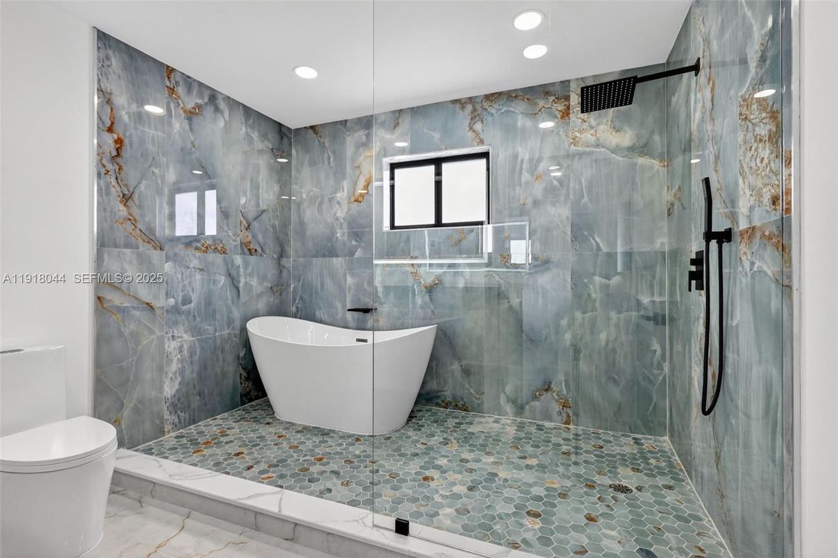 Bathroom, Free Standing Baths, Glass Shower, Interior, Marble Walls, Recessed Lighting