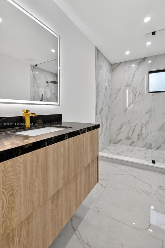 Bathroom, Dual Sink Vanities, Interior, Marble, Marble Walls, Recessed Lighting