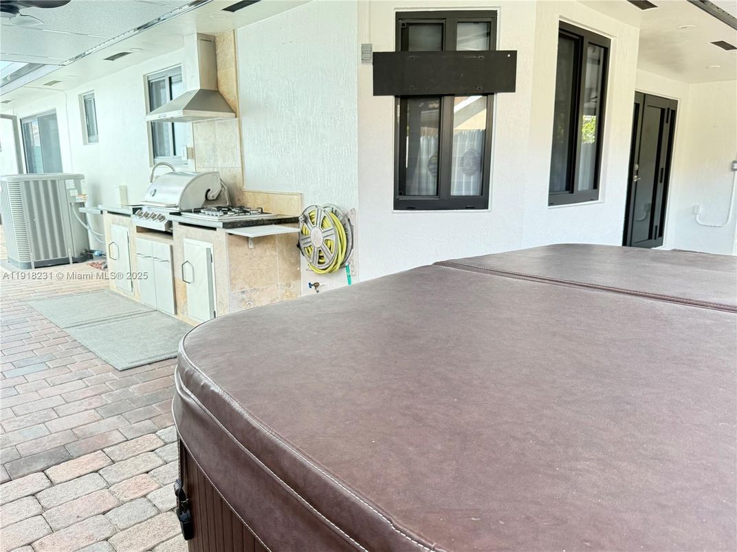 Exterior, Hot Tub, Outdoor Kitchen