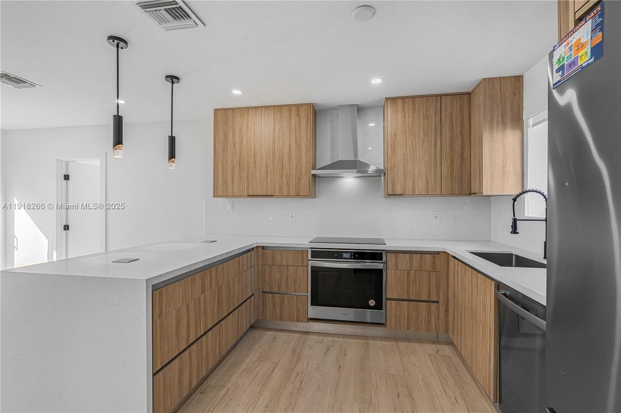 Interior, Kitchen, Pendant Lights, Recessed Lighting, Stainless Steel Appliances, Wood Texture Flooring