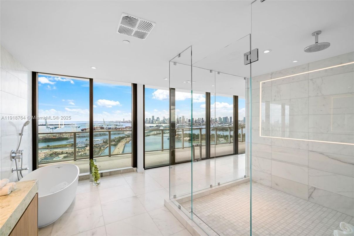 Bathroom, Free Standing Baths, Glass Shower, Interior, Marble, Marble Walls, Recessed Lighting, Water