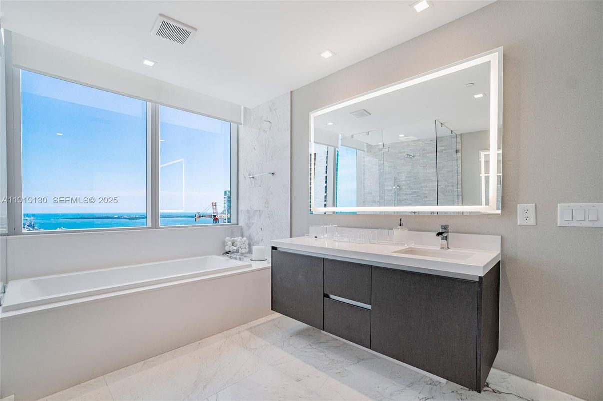 Bathroom, Dual Sink Vanities, Glass Shower, Interior, Marble, Marble Walls, Recessed Lighting, Water