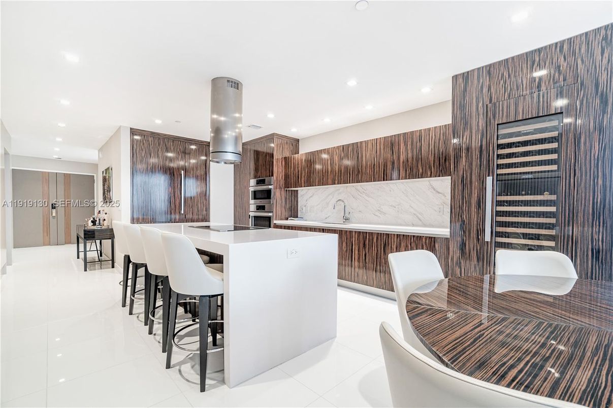 Interior, Kitchen, Marble Walls, Recessed Lighting, Stainless Steel Appliances