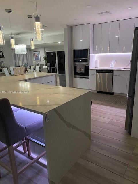 Interior, Kitchen, Pendant Lights, Recessed Lighting, Stainless Steel Appliances, Wood Texture Flooring