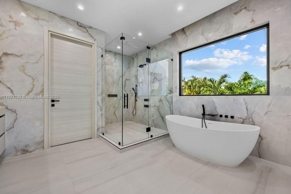 Bathroom, Free Standing Baths, Glass Shower, Interior, Marble Walls, Recessed Lighting