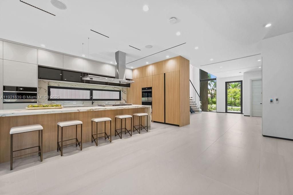 Interior, Kitchen, Marble Walls, Recessed Lighting, Stainless Steel Appliances