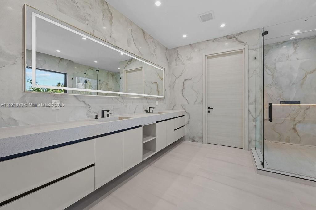 Bathroom, Dual Sink Vanities, Glass Shower, Interior, Marble Walls, Recessed Lighting