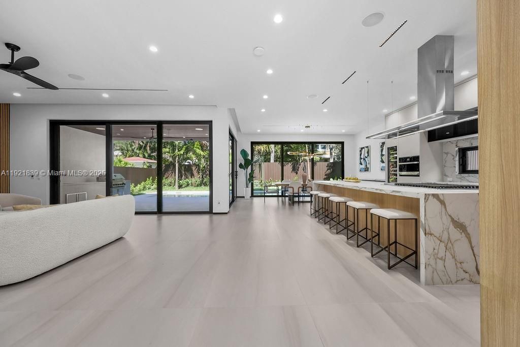 Interior, Kitchen, Marble Walls, Pendant Lights, Recessed Lighting, Stainless Steel Appliances