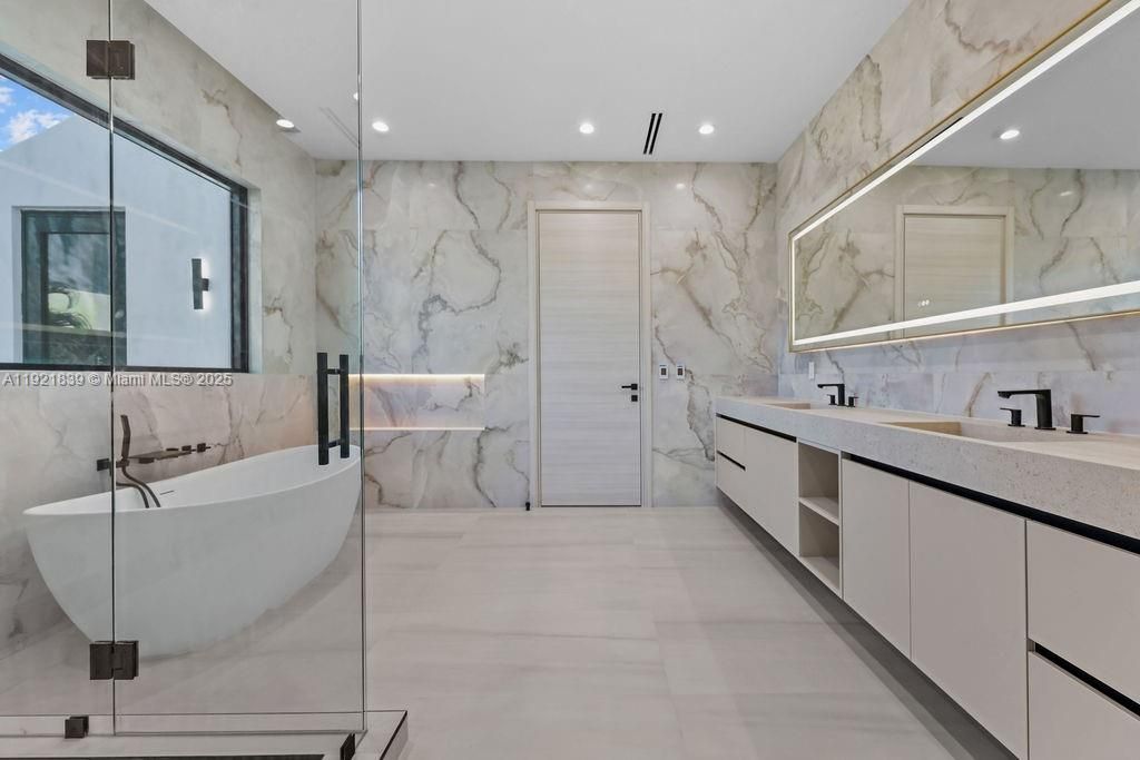 Bathroom, Dual Sink Vanities, Free Standing Baths, Glass Shower, Interior, Marble Walls, Recessed Lighting